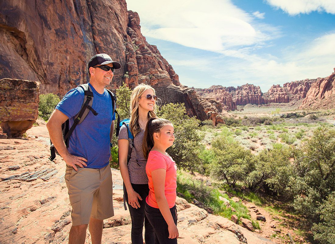 Employee Benefits - Family Looking Out at a Beautiful Scenic View in a Red Rock Canyon in the Southwest United States