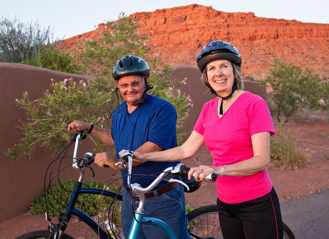 Medicare - Active Senior Couple Staying Healthy and Fit on Bikes in the Desert